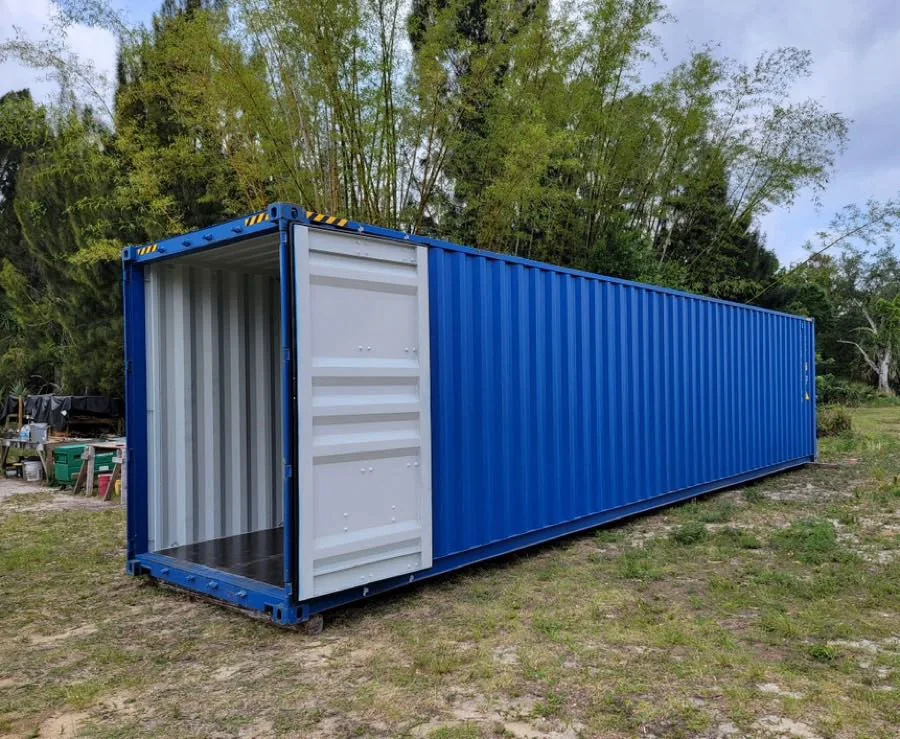 Blue high-cube shipping container with white cargo doors.